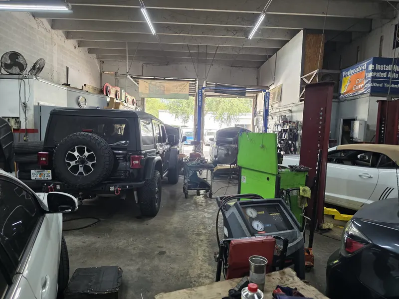Vehicles being serviced in the repair bay